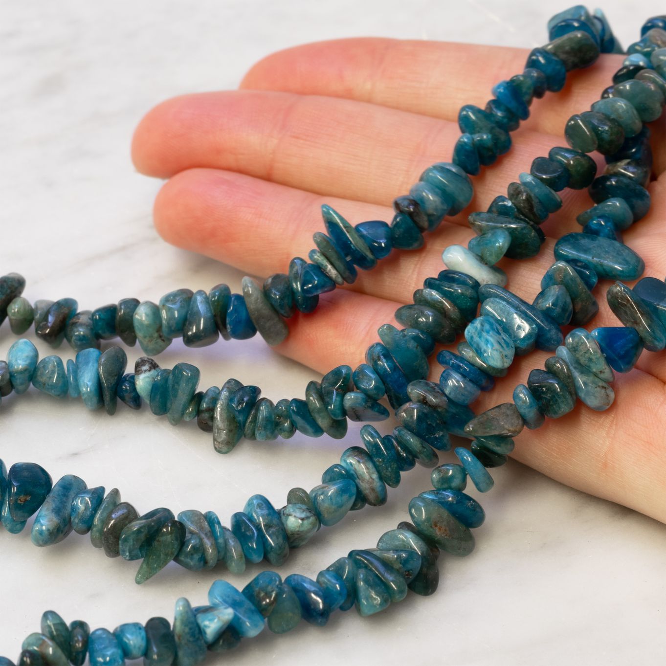 sot1787-apatite-chip-beads-kernowcraft-hand.jpg