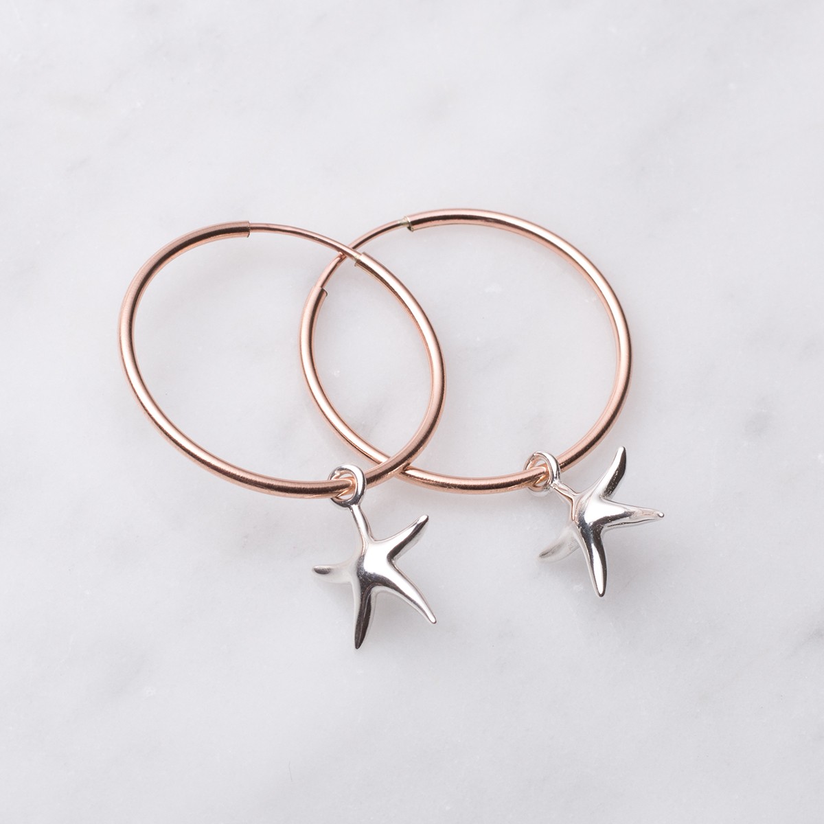 rose gold starfish hoop earrings.jpg