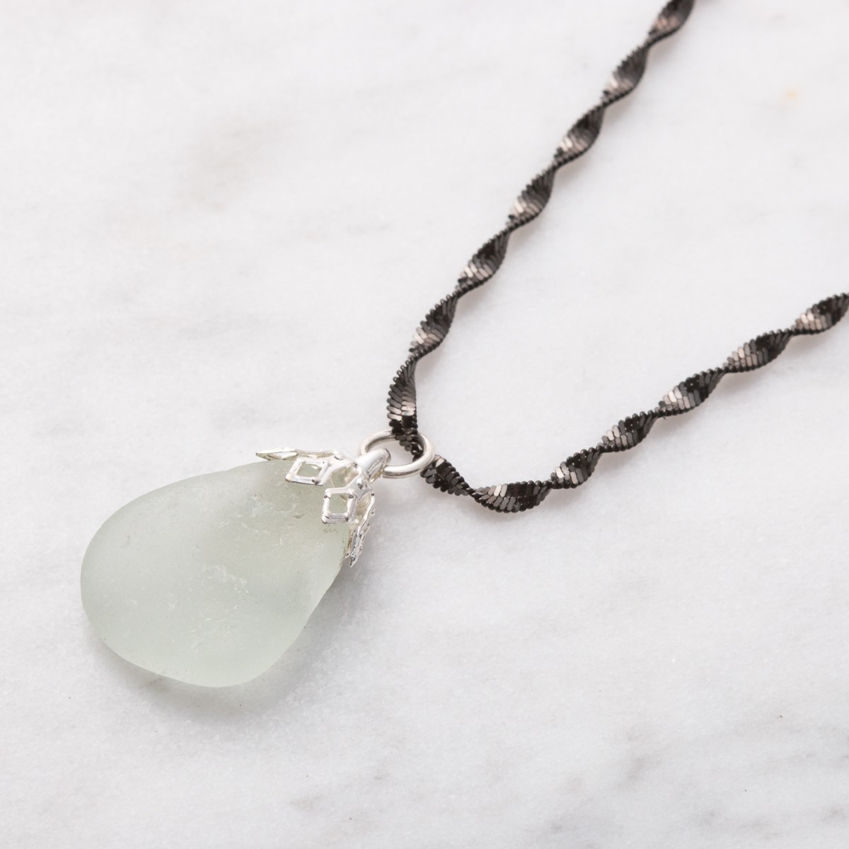 sn57 sea glass with bell cap and twisted chain.jpg