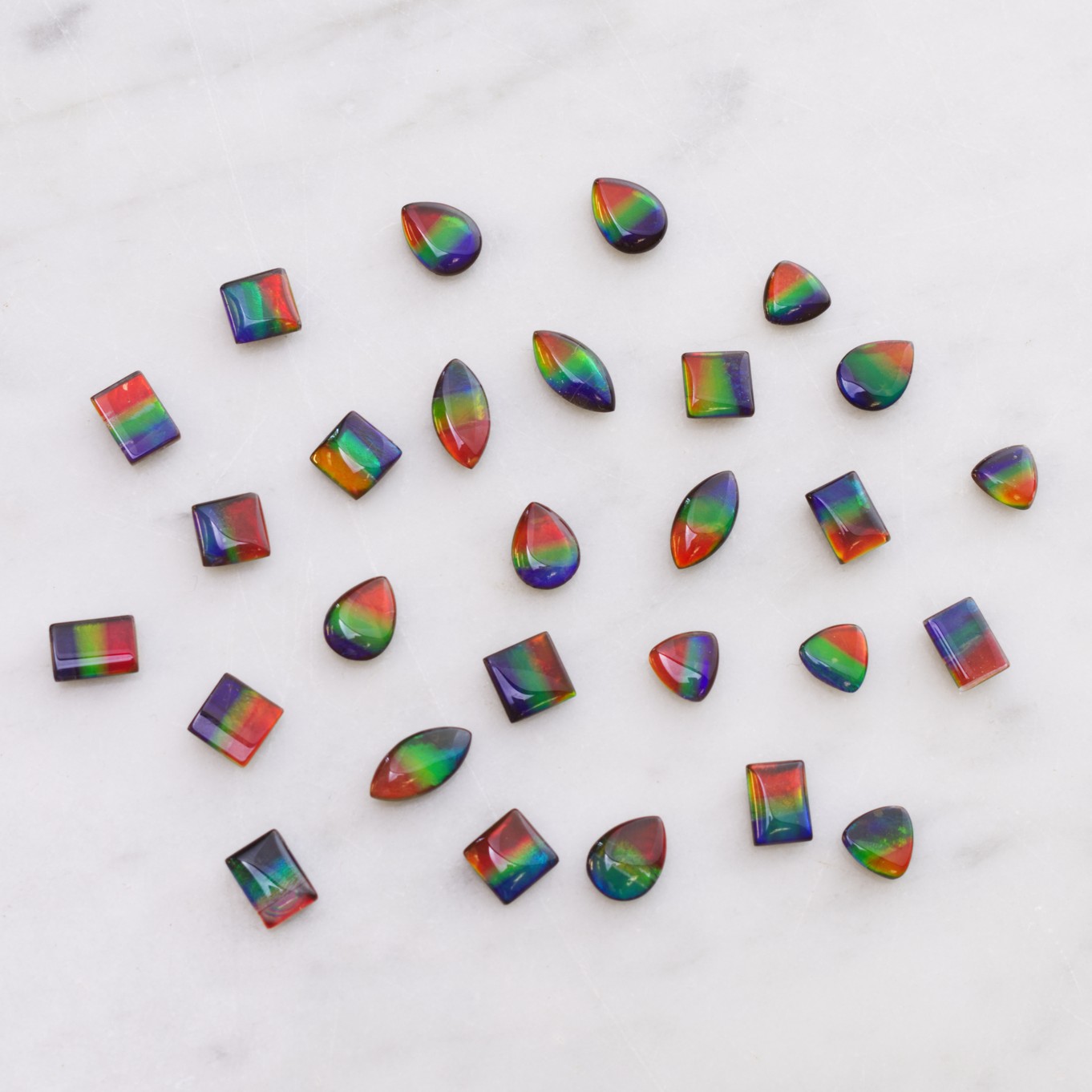 H228 ammolite mixed cabs.jpg